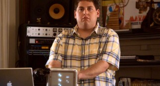 Cyrus (Jonah Hill) seriously shares one of his soundscapes with John.