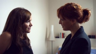 DI Anna Travis (Kelly Reilly) questions Julia Larson (Stine Stengade), the coy Danish wife of the slain former detective.
