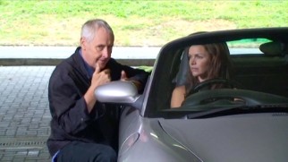 Gillies MacKinnon directs Danish actress Stine Stengade in a British car on the set of "Above Suspicion: Deadly Intent."