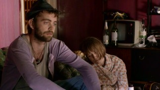 Amanda's death adds depression to the woes of her broke old roommates.