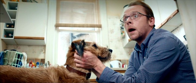 Neil (Simon Pegg) tries to silence Dennis the Dog (voiced by Robin Williams) when a neighbor hears him talking.