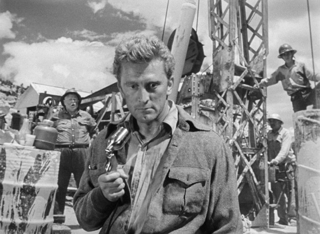 A sober Charles Tatum (Kirk Douglas) announces an update for the masses gathered at little Escudero, New Mexico in Billy Wilder's "Ace in the Hole."