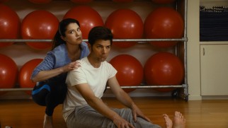 Yoga teacher/girlfriend Lauren (Mary Elizabeth Winstead) helps Carter (Adam Scott) get limber.