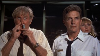 Things aren't less stressful on the ground for air traffic controllers McCroskey (Lloyd Bridges) and Kramer (Robert Stack).