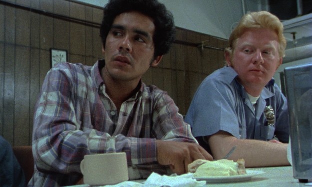 Illegal alien Roberto Ramírez (Domingo Ambriz) is a bit uncomfortable about trying his favorite diner's apple pie and ice cream at a counter next to a cop (Officer Mark Herder) in "ˇAlambristaˇ"