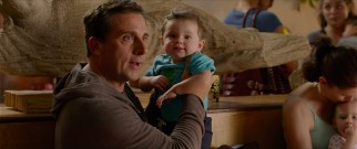 Ben Cooper (Steve Carell) is holding Trevor when the baby utters his first word: fommy.
