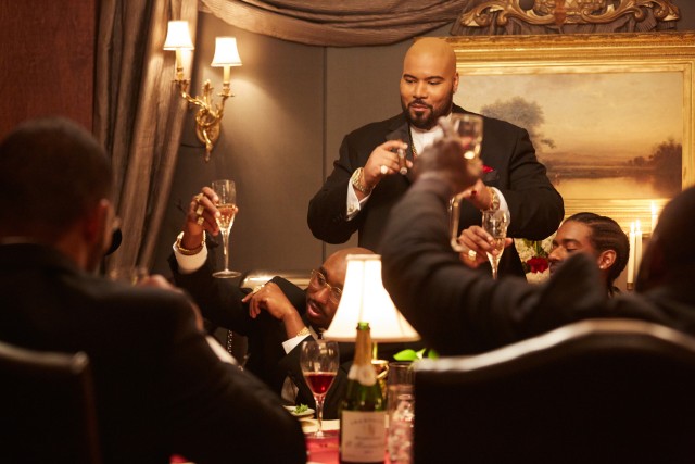 CEO Suge Knight (Dominic L. Santana) welcomes 2Pac (Demetrius Shipp Jr.) to the Death Row Records family in an awkward dinner gathering.