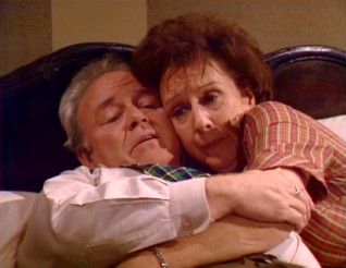 Archie (Carroll O'Connor) and Edith (Jean Stapleton) share a tender moment in bed together in the series' closing scene.