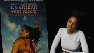 Sasha Lane discusses her film debut across from the "American Honey" poster bearing her likeness.