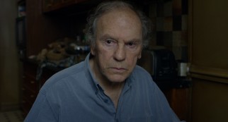 Troubled by his wife's physical and mental deterioration, Georges (Jean-Louis Trintignant) nonetheless remains supportive.