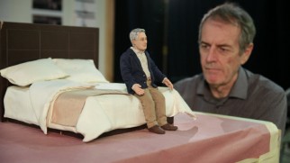 An animator positions Michael Stone on his hotel bed in "Intimacy in Miniature."