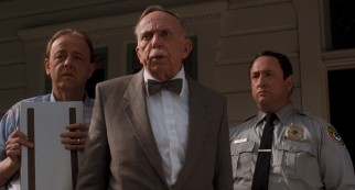 Ross has to answer to men of Canaima including mortician (Roy Brocksmith), doctor (Henry Jones), and sheriff (Stuart Pankin).