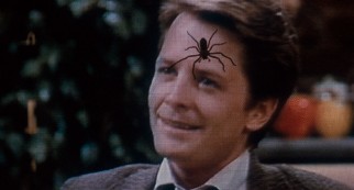 A televised Alex P. Keaton (Michael J. Fox) doesn't stand a chance against an "Arachnophobia" spider. (Second pressing)