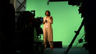 Russell Brand performs a scene on green screen in "Making 'Army of One.'"