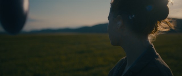 Louise Brooks (Amy Adams) gathers her thoughts in Montana, the site of one of twelve hovering alien spacecrafts.