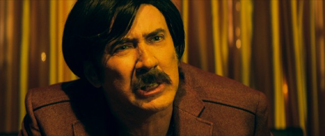 A wig, fake mustache, and prosthetic nose help Nicolas Cage look more outrageous than usual as Eddie King, the closest thing that Biloxi, Mississippi has to a gangster.