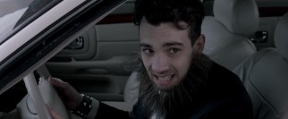 A clean record makes Francie (Jay Baruchel) the one to drive across the border in a fake beard.