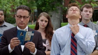 While father (Andy Garcia) peruses a Middleton brochure, son (Spencer Lofranco) tugs at the necktie he didn't want to wear.