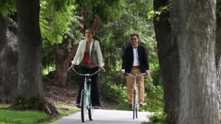 A shot of Vera Farmiga and Andy Garcia's bike ride around campus is one of the stills featured in the slideshow video of Garcia's original song "There Was a Day."