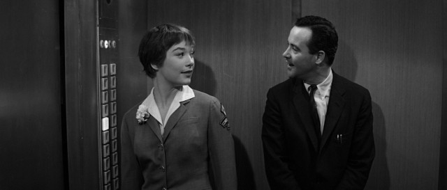 Going up! Bud (Jack Lemmon) rides the elevator operated by Fran (Shirley MacLaine) up to a promotion on the 27th floor.