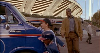 Smiles light up the faces of George Knox (Danny Glover), Roger (Joseph Gordon-Levitt), and J.P. (Milton Davis Jr.).