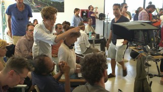 Tilda Swinton looks like she's directing instead of her two-time collaborator Luca Guadagnino in this behind-the-scenes shot.