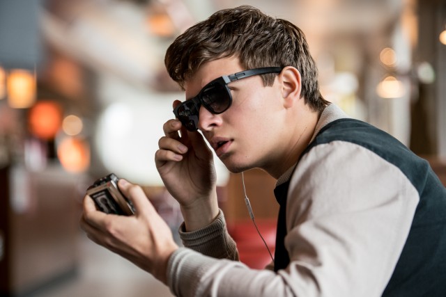 "Baby Driver" stars Ansel Elgort as Baby, a young, laconic getaway driver who drowns out tinnitus with earbud-supplied tunes.