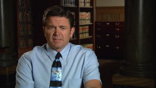 John Michael Higgins discusses his dolphin-loving character, Principal Wally Snur.