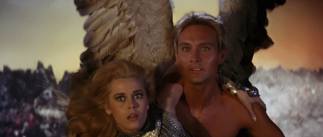 Barbarella (Jane Fonda) gets carried into Sogo by blind angel Pygar (John Phillip Law), the last of the ornithanthropes.