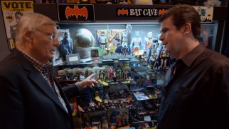Ralph Garman shows Adam West his extensive Batcollection in "Holy Memorabilia, Batman!"