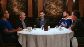 Adam West talks with Kevin Smith (in a Fatman hockey jersey) and other accomplished admirers in "Bats of the Round Table."