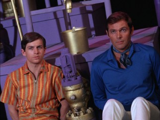 Outside of their costumes, Dick Grayson (Burt Ward) and Bruce Wayne (Adam West) are just a couple of groovy bachelors of the late 1960s.