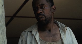 Seemingly widowed Wink (Dwight Henry) parents Hushpuppy with more stubbornness than common sense.