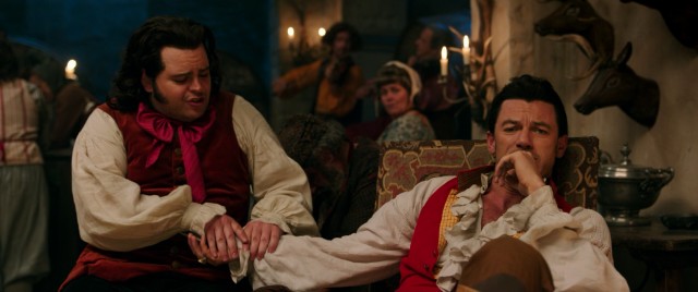 Luke Evans plays Belle's macho suitor Gaston and Josh Gad is his subtly smitten comic sidekick LeFou.