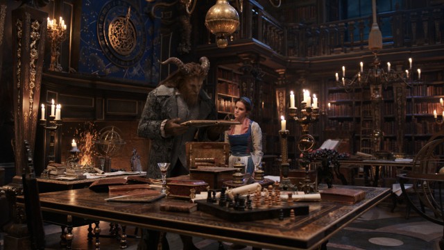 Beast (Dan Stevens) lets Belle (Emma Watson) marvel at his impressive library in 2017's "Beauty and the Beast."