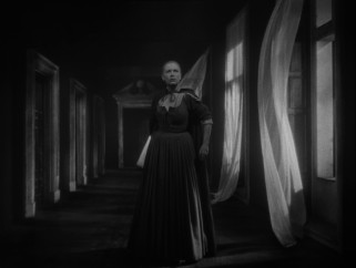 Belle (Josette Day) rolls past blowing curtains in the film's most iconic shot.