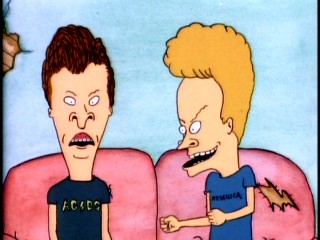 Butt-head and Beavis assume their standard TV-watching couch poses in their dilapidated home of unclear ownership.