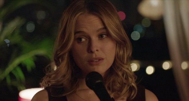 Backed by Nick's trumpet, Brooke (Alice Eve) sings "My Funny Valentine" to a gathering she doesn't know.