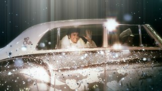 Liberace makes a flashy stage entrance in a car driven by Scott on the Blu-ray's main menu.