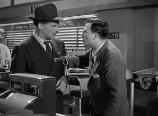 Hook-handed Homer (Harold Russell) takes exception to this vocal diner's anti-American sentiment.