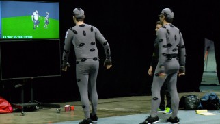 Bill Hader and Jemaine Clement walk in motion capture suits and watch their computer-animated counterparts do the same in "Giants 101."