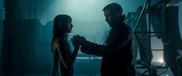 K (Ryan Gosling) holds his digital girlfriend Joi (Ana de Armas) in "Blade Runner 2049."