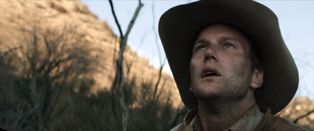 Injured but determined, Arthur O'Dwyer (Patrick Wilson) ambles on in an effort to rescue his wife.