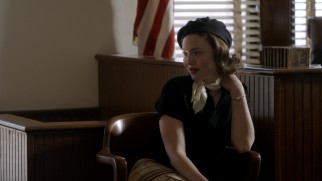 Bonnie Parker (Holliday Grainger) uses her feminine guile to coast through some perjury.