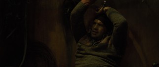 Billy Zane spends most of "Border Run" silent and chained up.