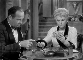 Billie Dawn (Judy Holliday) seems incapable of doing much more than playing gin rummy with her wealthy husband-to-be, Harry Brock (Broderick Crawford).