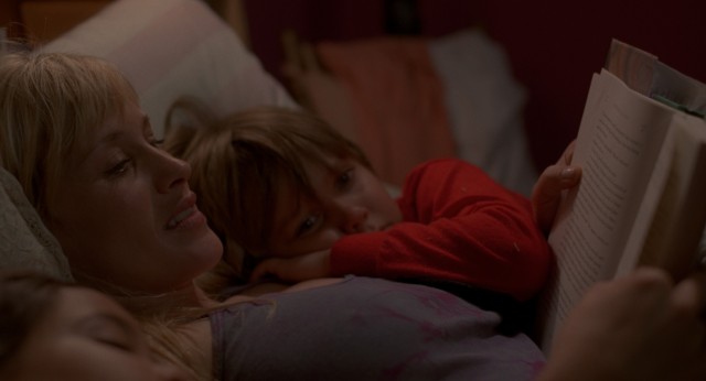 Olivia (Patricia Arquette) reads a bedtime story to Mason Jr. (Ellar Coltrane) in "Boyhood."