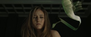 Abby (Leelee Sobieski) finds she has to compete with the hallucinogenic fish-like creature on her back for Misha's attention.