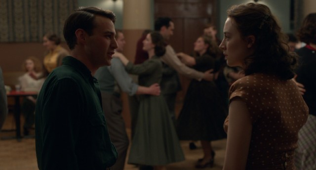 Ellis (Saoirse Ronan) meets Italian-American plumber Tony Fiorello (Emory Cohen) at a lifeless Irish community dance.