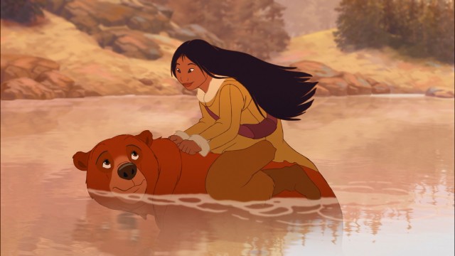 Water-fearing Nita gets a ride from Kenai, her transformed childhood companion, in Disney's "Brother Bear 2."